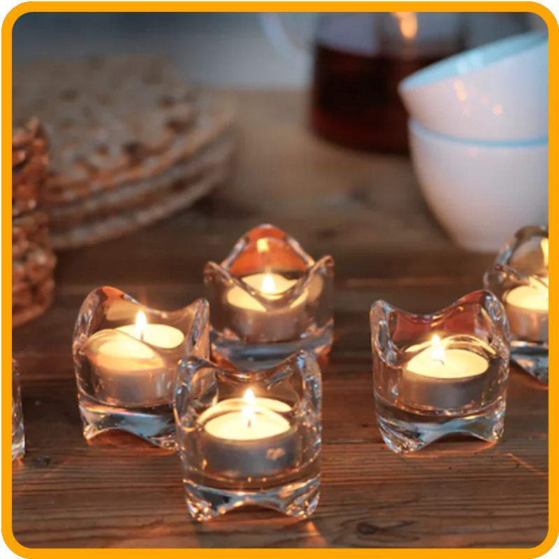 Soft, glowing light from Unscented Tea Light Candles – 4-Hour Long Burn – Pack of 30/50/100 – White for any occasion.