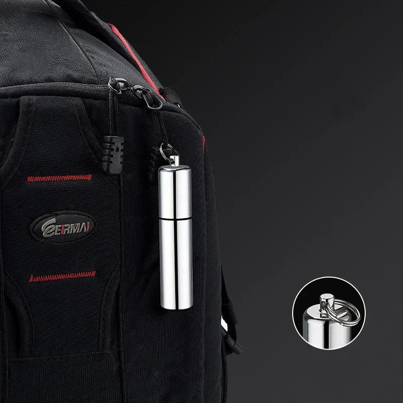 Mini Windproof Metal Kerosene Lighter Keychain – Refillable Survival Fire Starter attached to a backpack for easy carry.
