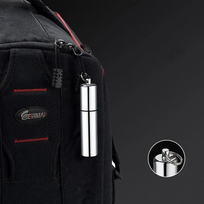 Mini Windproof Metal Kerosene Lighter Keychain – Refillable Survival Fire Starter attached to a backpack for easy carry.