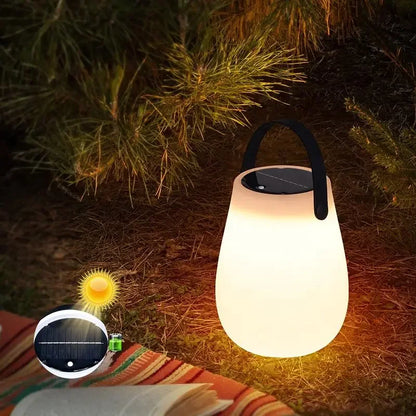 Illuminate your outdoor adventures with the Solar LED Table Lantern – Portable Outdoor Camping Light, USB rechargeable and weatherproof.
