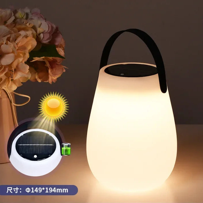 Brighten your outdoor adventures with the Solar LED Table Lantern – Portable Outdoor Camping Light | USB Rechargeable, Weatherproof PE Design with Silicone Handle.