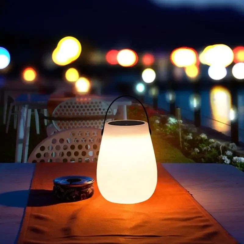 Illuminate your nights with the Solar LED Table Lantern – Portable Outdoor Camping Light, perfect for any setting.