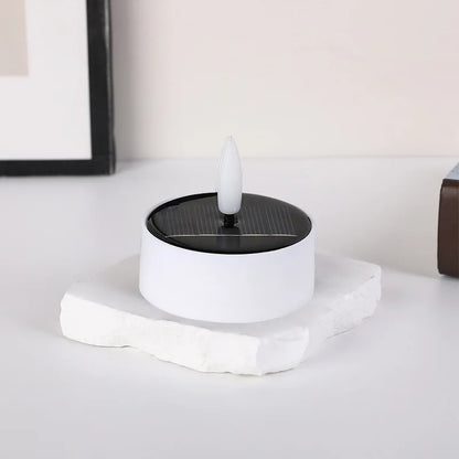 Solar Flameless LED Tea Light Candle – 6cm Flickering Yellow Light for safe outdoor ambience, camping, and emergencies.